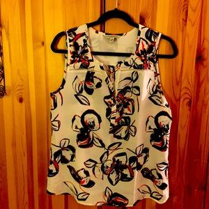 Sleeveless top; white with blue and red swirls